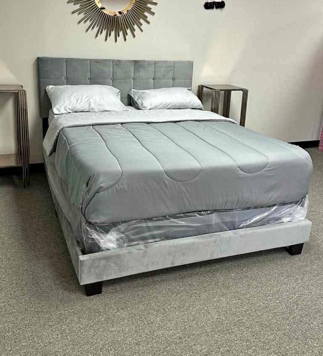Grey tufted bed set with bedding