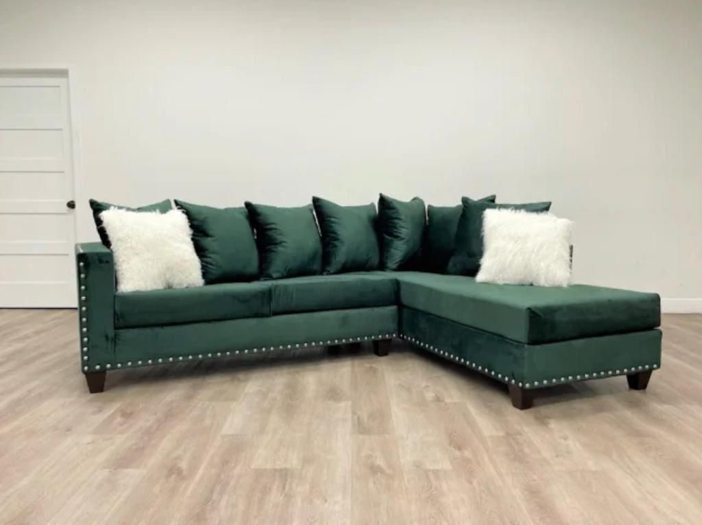 Emerald green velvet sectional with nailhead trim