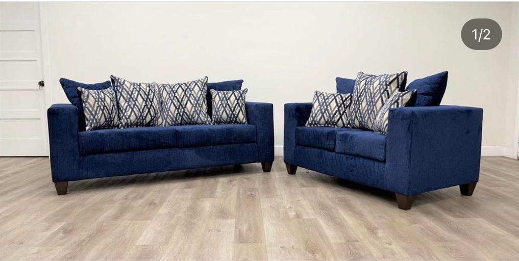 Navy velvet sofa and loveseat set with diamond pattern pillows