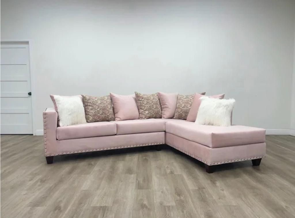 Blush pink velvet sectional with nailhead trim