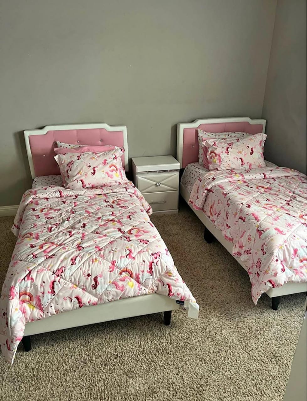 Twin bed set with pink unicorn bedding