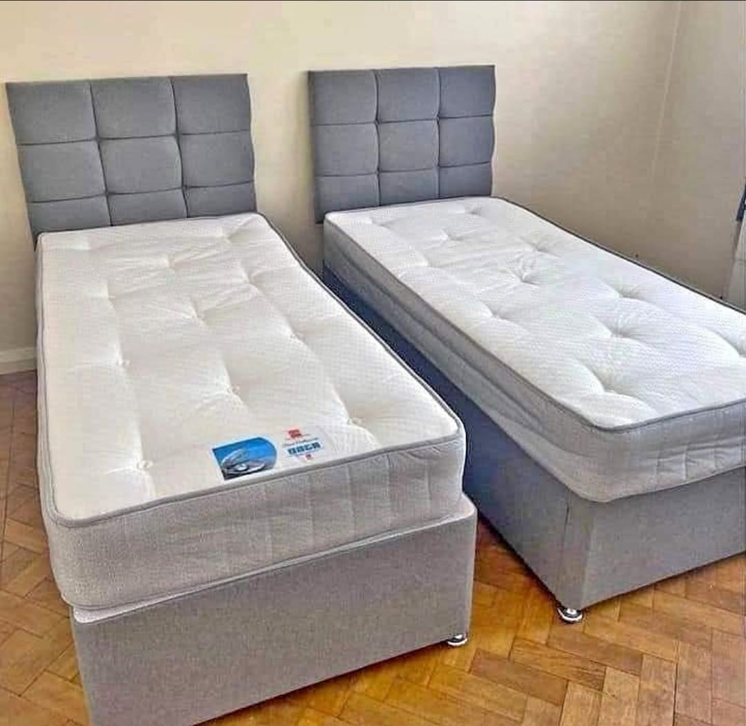 Twin bed set with grey tufted headboards
