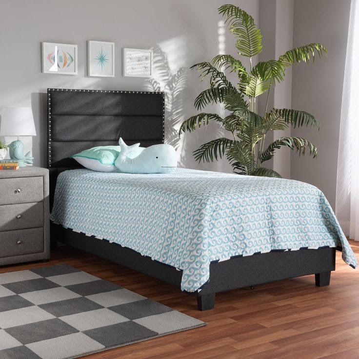 Twin bed with charcoal upholstered headboard